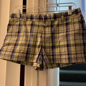 Adorable plaid shorts with zipper, clasp and drawstring.